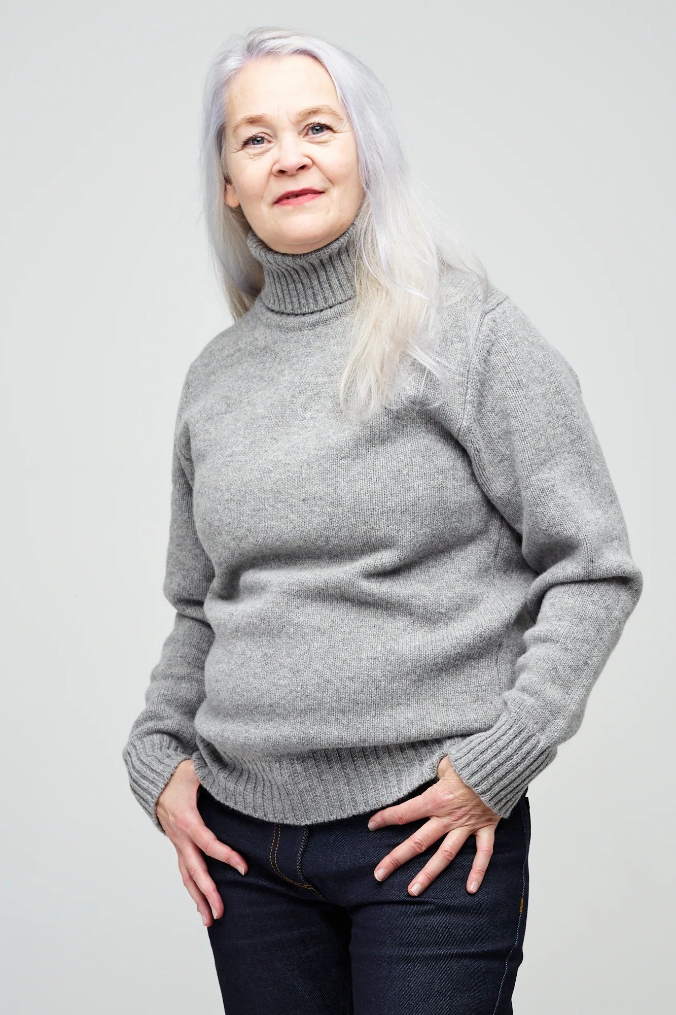 Gray Turtleneck with Dark Jeans on a woman over 60, cozy winter casual outfit idea 2