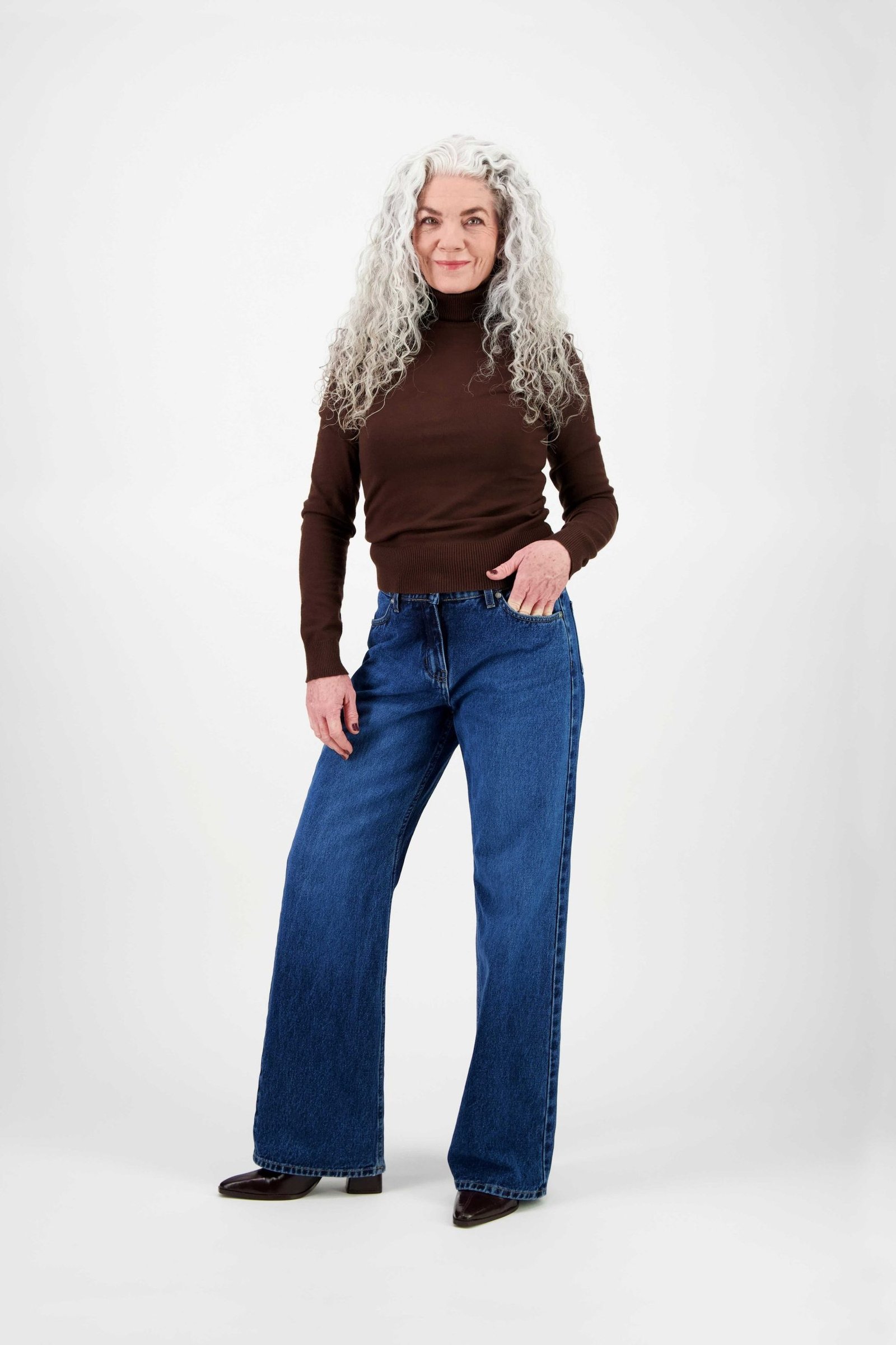 Brown Turtleneck with Wide-Leg Jeans on a woman over 60, cozy winter casual outfit idea 4