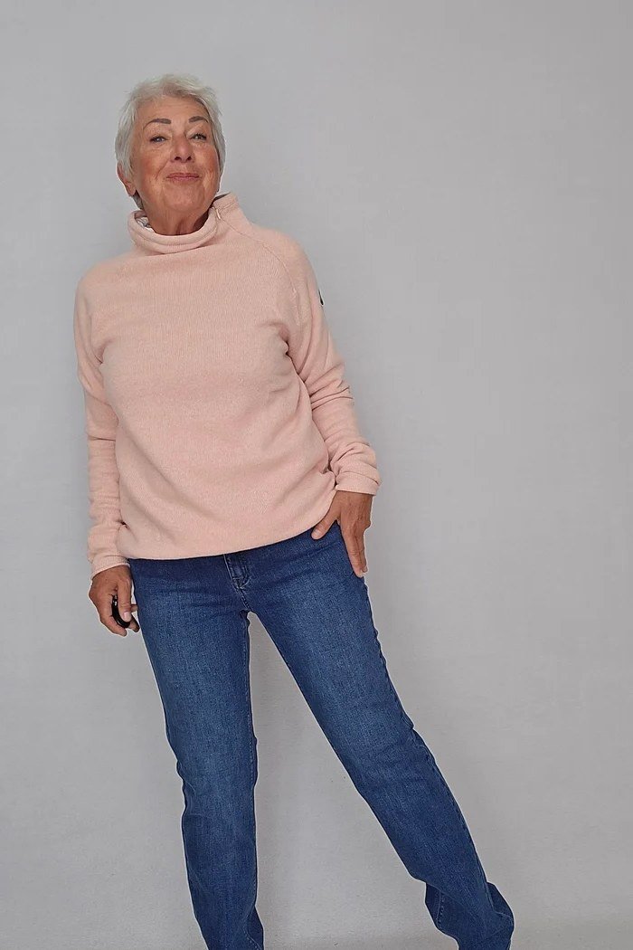 Blush Pink Turtleneck with Dark Jeans on a woman over 60, cozy winter casual outfit idea 7