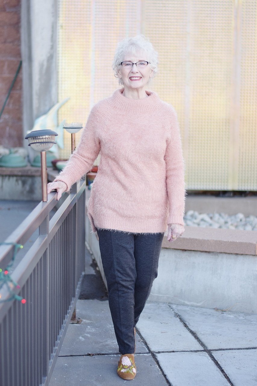 Pink Fuzzy Sweater with Dark Jeans on a woman over 60, cozy winter casual outfit idea 10