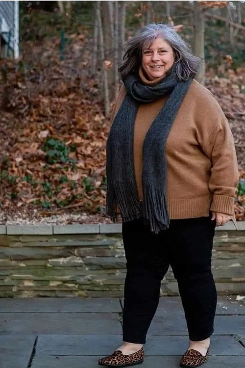 Camel Sweater with Black Scarf and Black Pants on a woman over 60, cozy winter casual outfit idea 12
