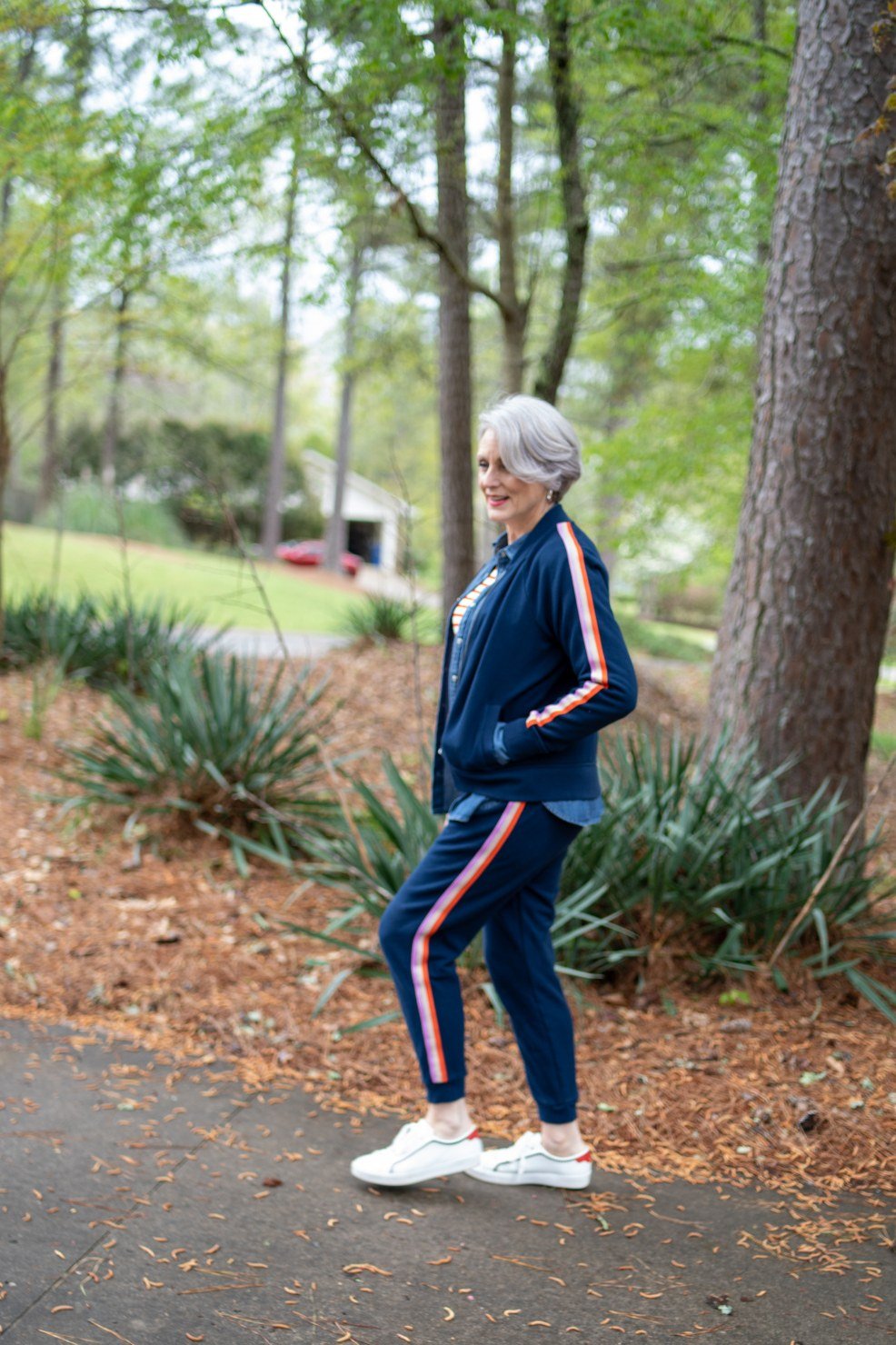 Navy Track Jacket with Blue Pants on a woman over 60, cozy winter casual outfit idea 23