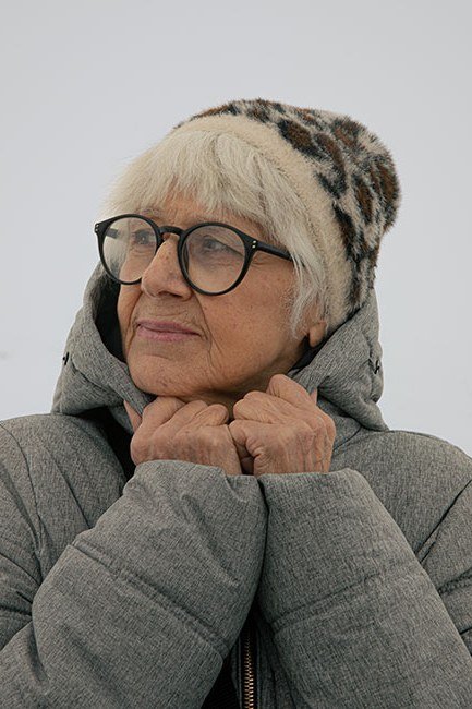 Gray Coat with Leopard Beanie on a woman over 60, cozy winter casual outfit idea 29