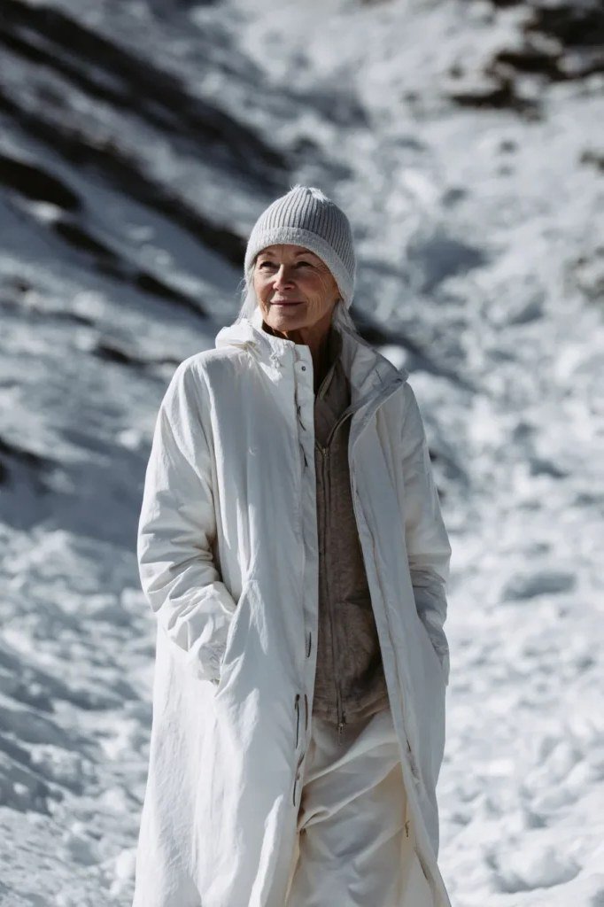 Cream Long Coat with Gray Beanie on a woman over 60, cozy winter casual outfit idea 30