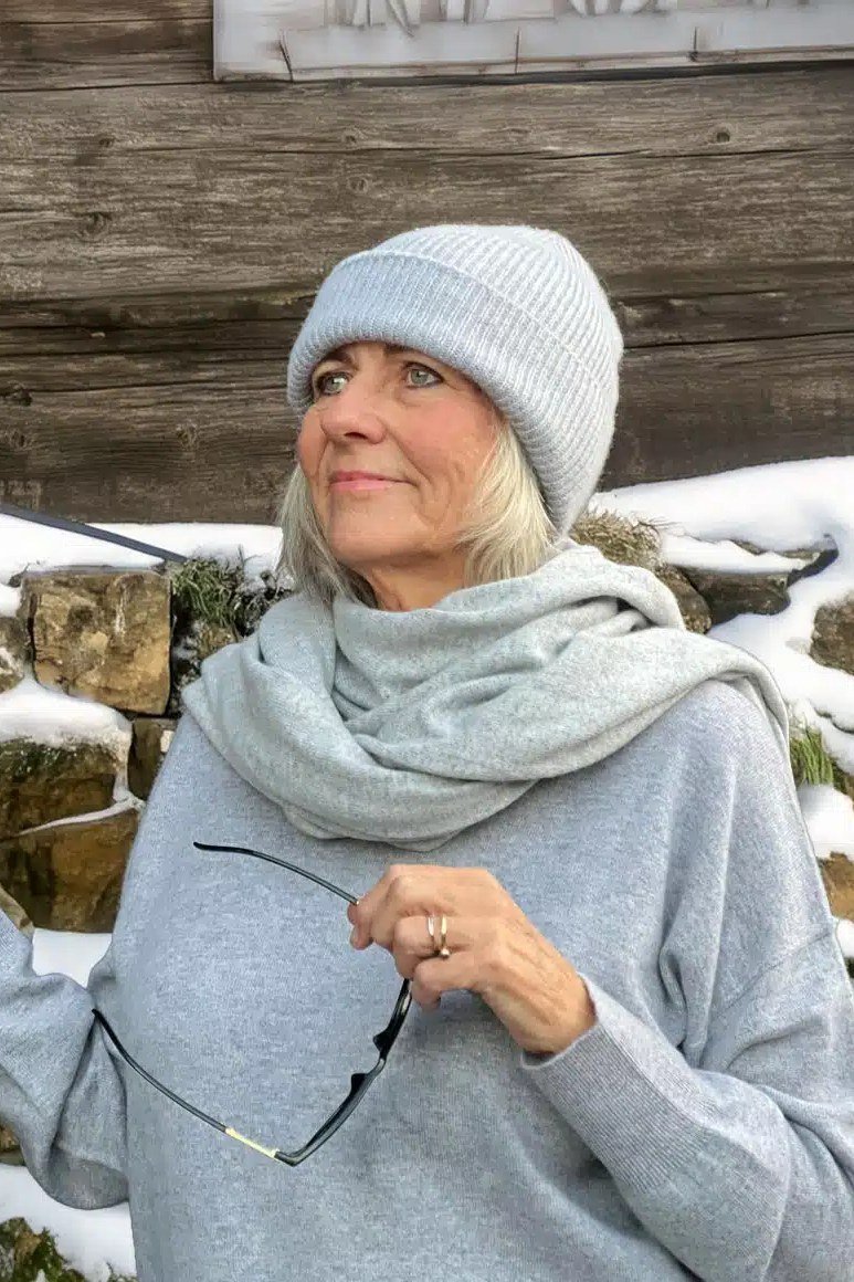 Light Gray Sweater with Cream Scarf on a woman over 60, cozy winter casual outfit idea 35