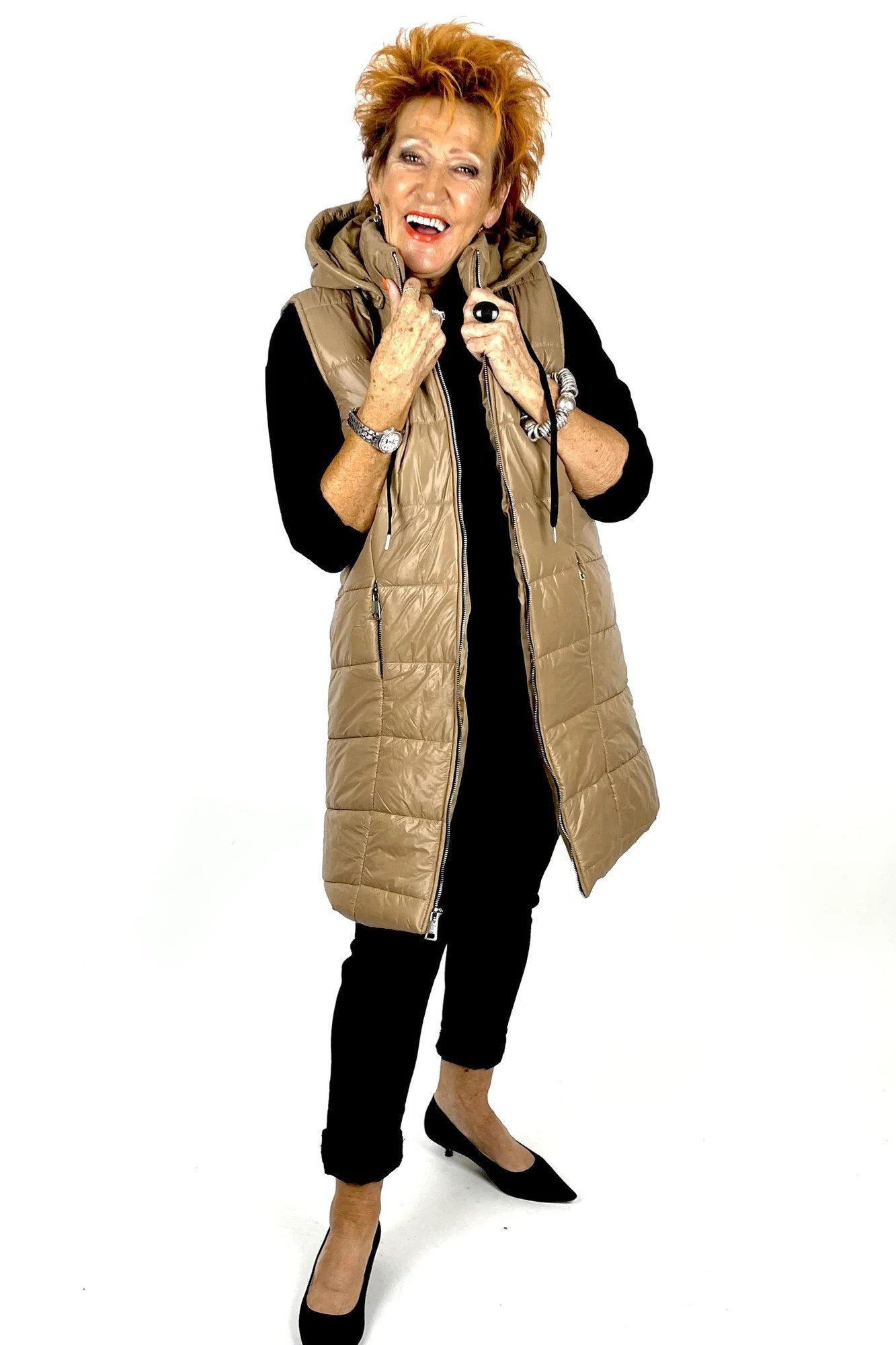 Tan Long Puffer Vest with Black Outfit on a woman over 60, cozy winter casual outfit idea 43