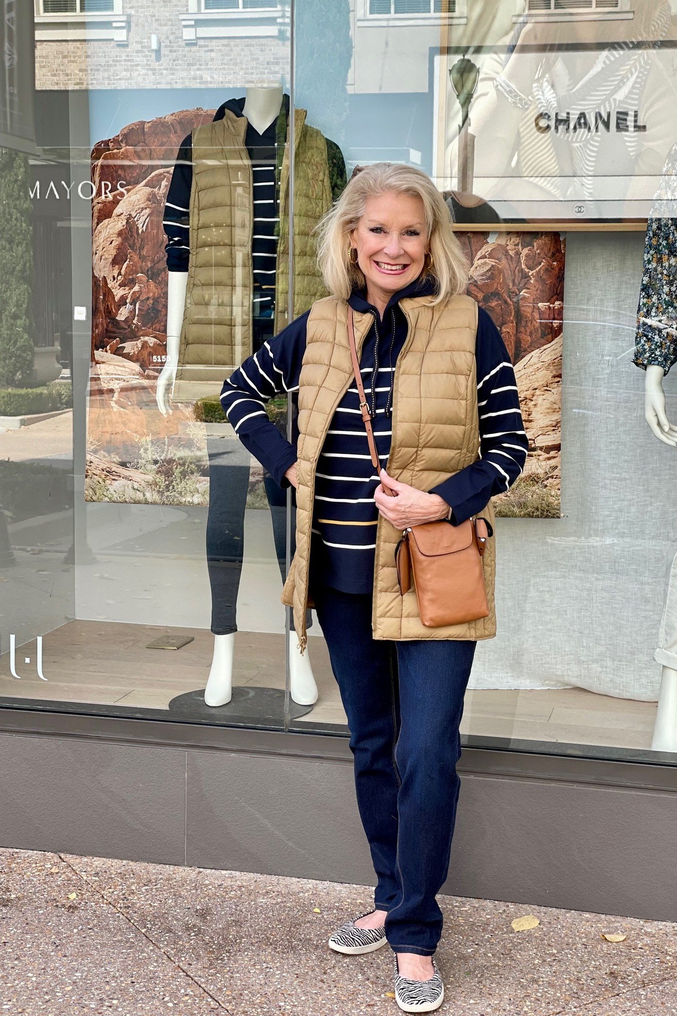 Tan Vest with Striped Tee and Jeans on a woman over 60, cozy winter casual outfit idea 44