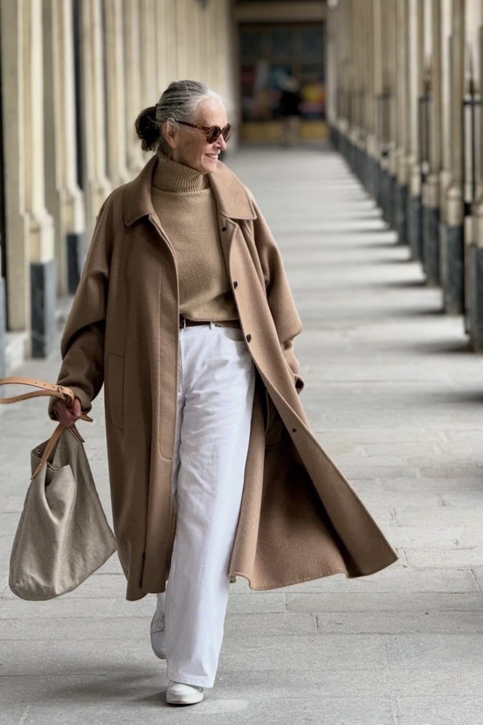 Camel Coat with White Wide-Leg Pants on older woman, cozy winter outfit for women over 60