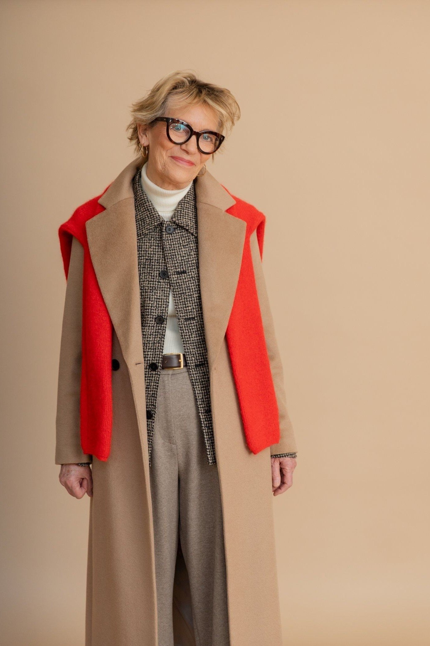 Camel Coat with Bold Red Scarf on older woman, cozy winter outfit for women over 60