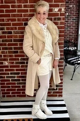 Cream Shearling-Trim Coat with White Trousers on older woman, cozy winter outfit for women over 60