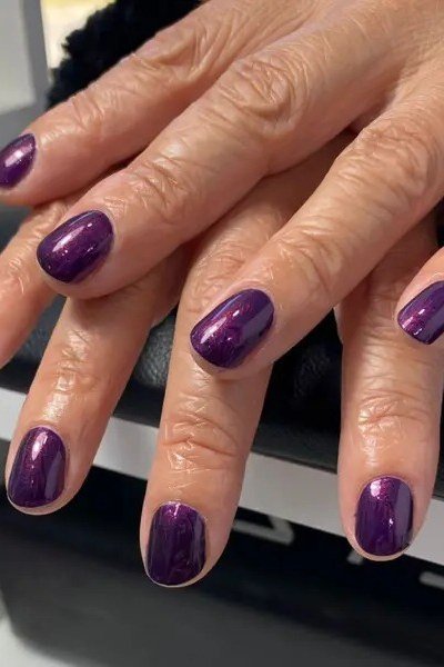 Soft Pink Nails in a Grey Knit - winter nail idea for women over 60