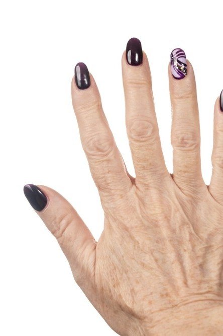 Oxblood Red with an Ornate Ring - winter nail idea for women over 60