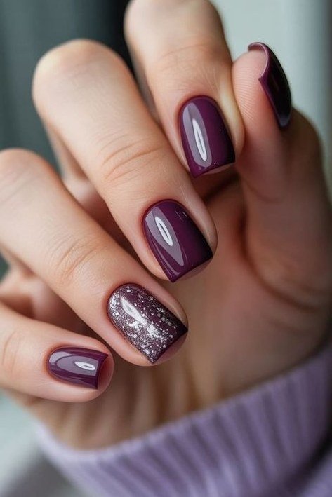 Burgundy short winter nails with silver glitter accent nail