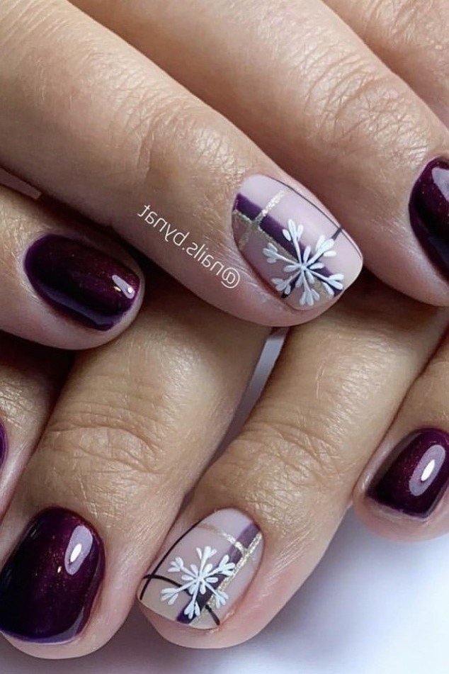 Dark plum short winter nails with white snowflake accents