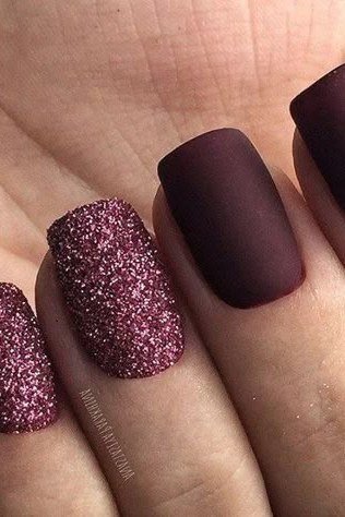 Matte plum short winter nails with pink glitter accents