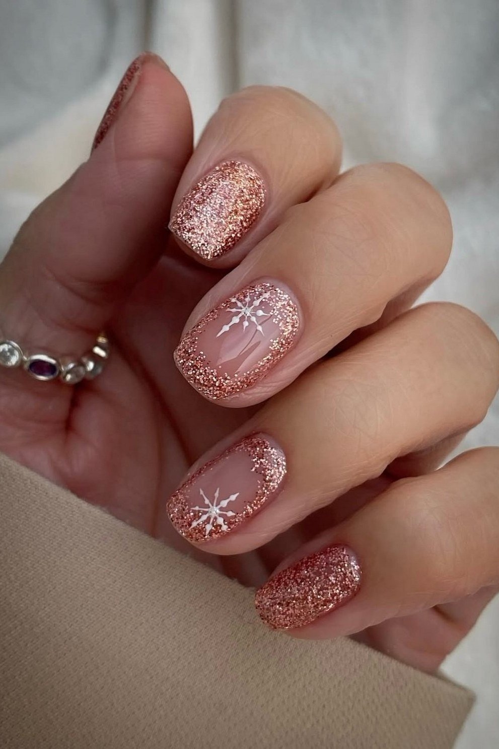 Rose gold glitter short winter nails with snowflake art