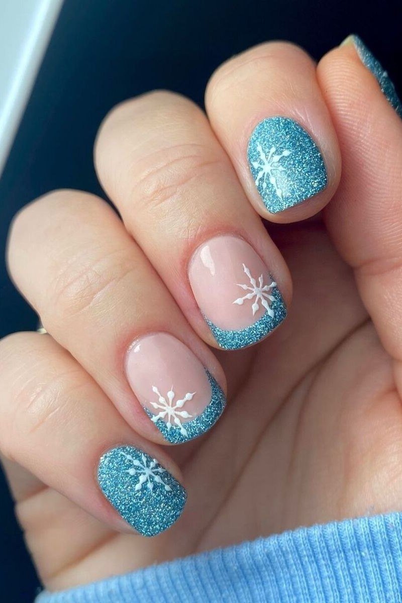 Icy blue glitter short winter nails with snowflake art