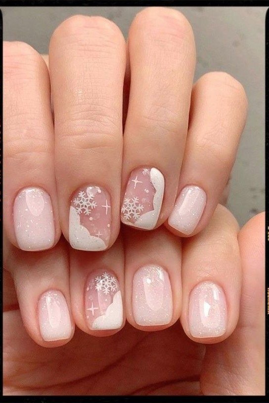 Sheer pink short winter nails with snowflake art