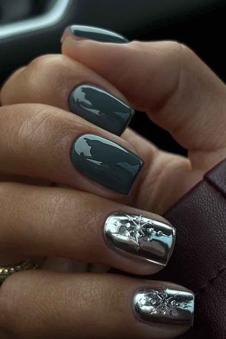Slate gray blue nails with silver snowflake chrome accent