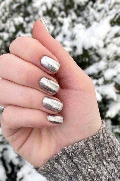 Silver chrome short nails with snowy tree backdrop