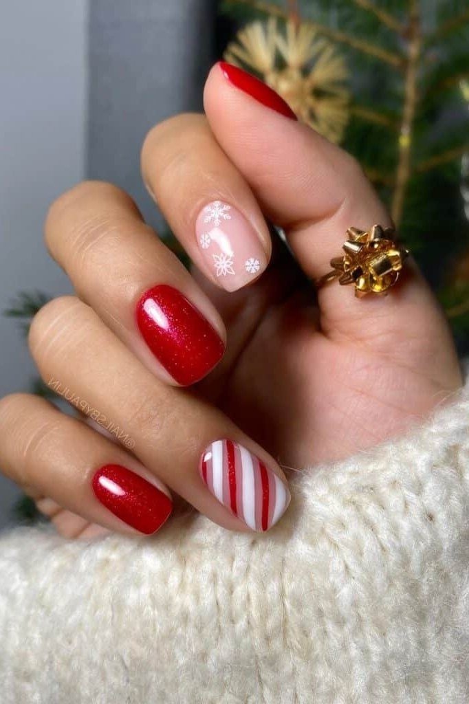 Red short winter nails with candy cane stripe accent