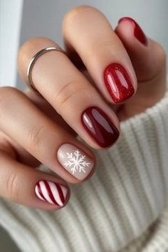 Burgundy nails with snowflake and candy cane accents