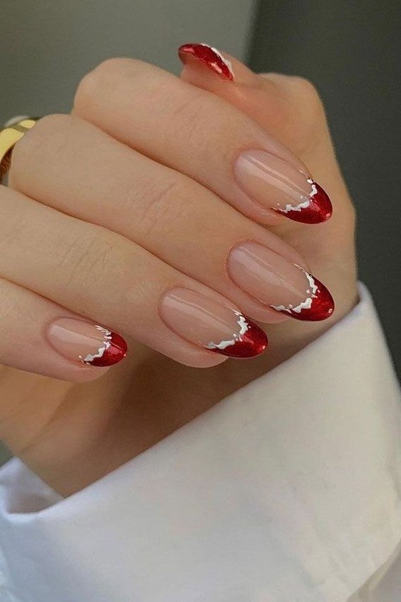 Red french tip on nude with silver accents and white cuff