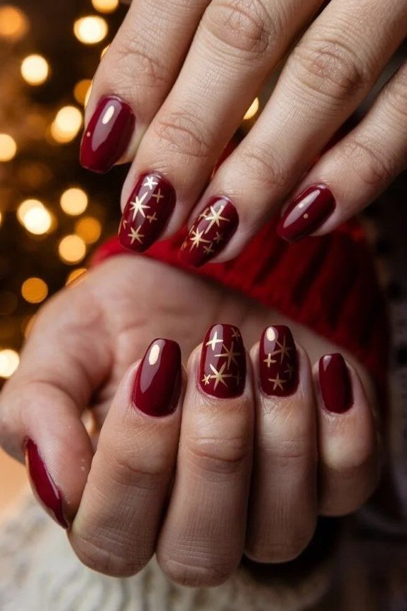 Red Nails with Gold Shimmer and String Lights - timeless winter nail color for women over 60
