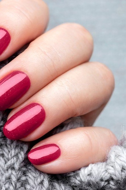 Fuchsia Berry Nails with a Gray Knit - timeless winter nail color for women over 60