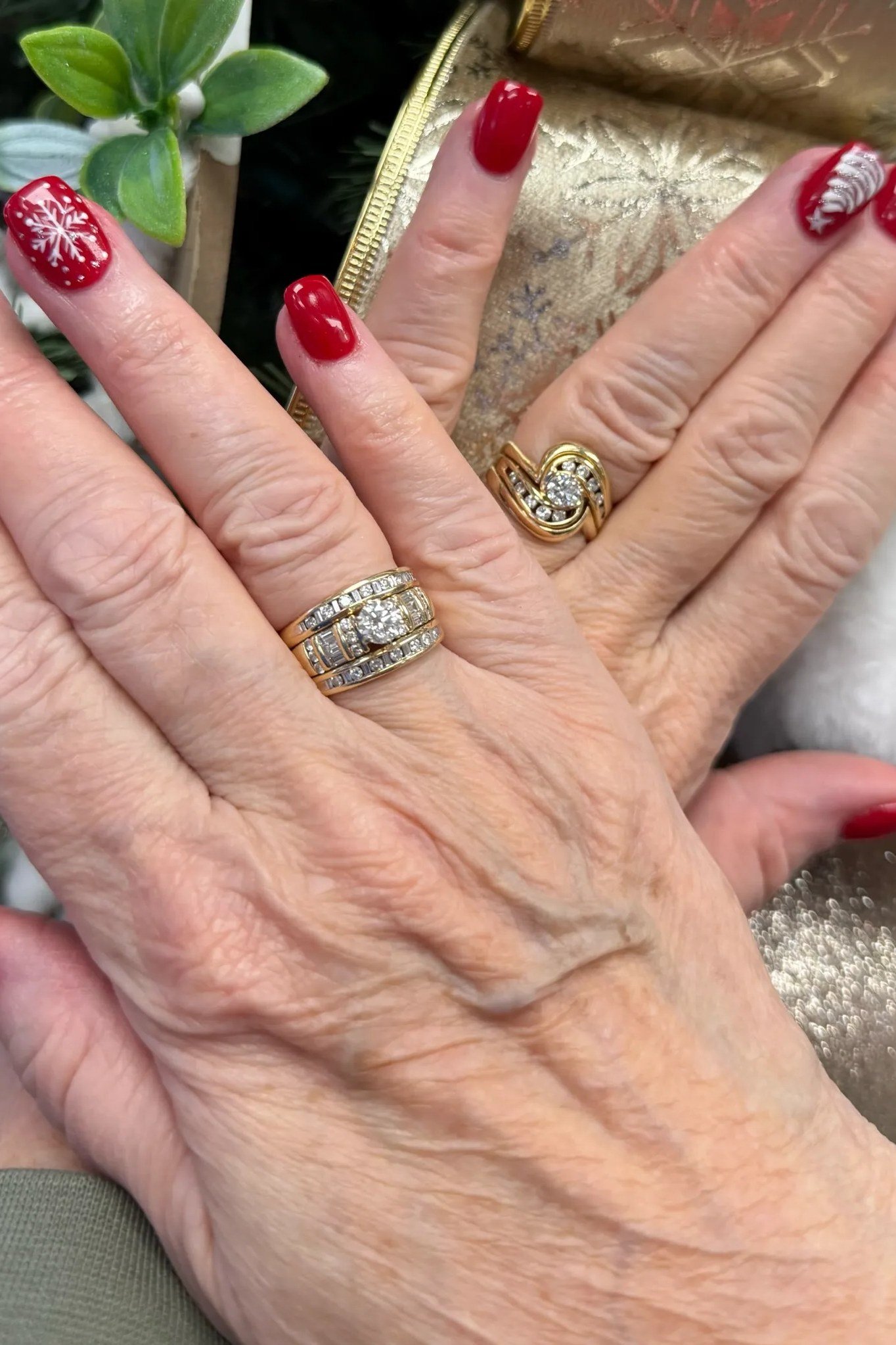 Red Nails with Snowflake Art on Mature Hands - timeless winter nail color for women over 60