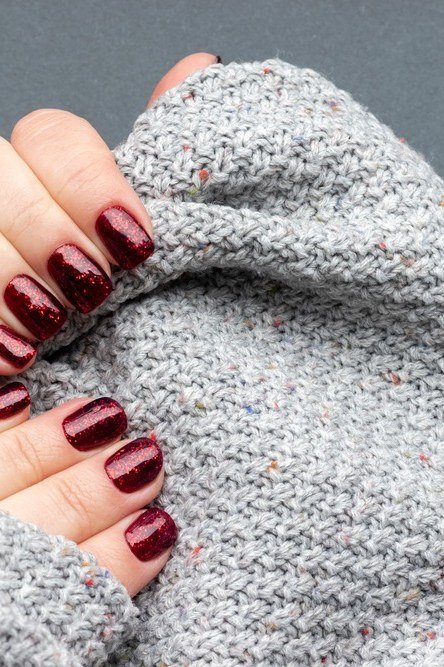 Oxblood Nails with a Gray Knit - timeless winter nail color for women over 60