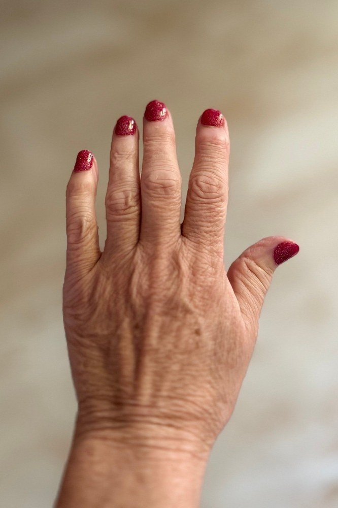 Oxblood Nails on a Mature Hand - timeless winter nail color for women over 60