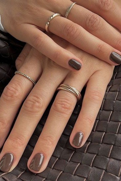 Espresso Taupe Nails with a Woven Bag - timeless winter nail color for women over 60