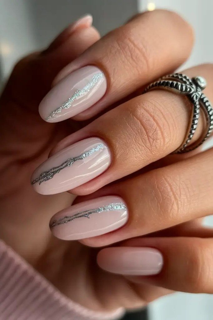 Pale Nude Almond Nails with Silver Line Art - timeless winter nail color for women over 60