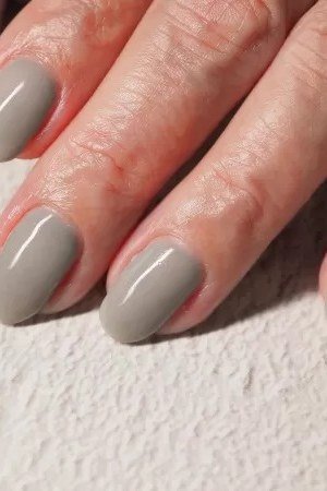 Slate Gray Nails on Mature Hands - timeless winter nail color for women over 60