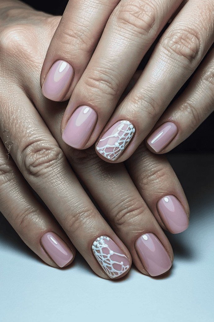 Pink Nails with White Lace Accent Art - timeless winter nail color for women over 60