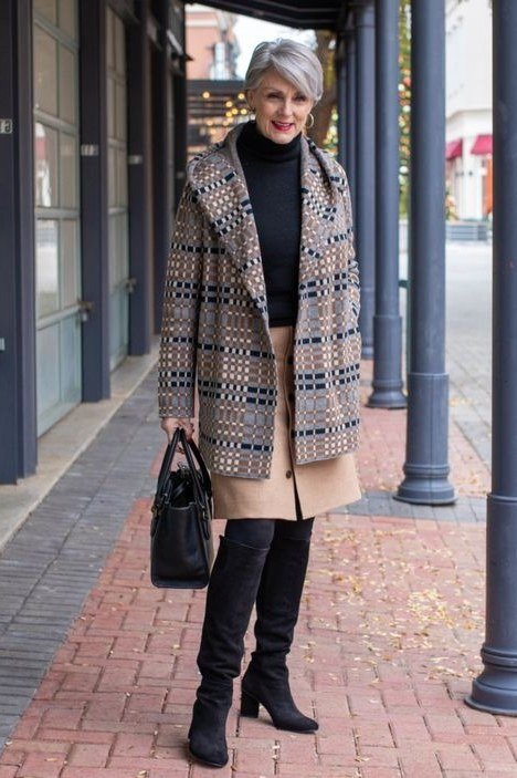 Plaid tweed jacket over black turtleneck and black trousers with knee boots, winter outfit idea for older women