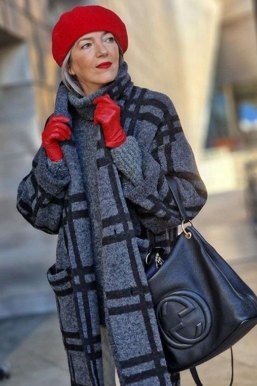 Gray black plaid coat with bright red beret and red gloves, joyful winter accessory outfit for women over 60