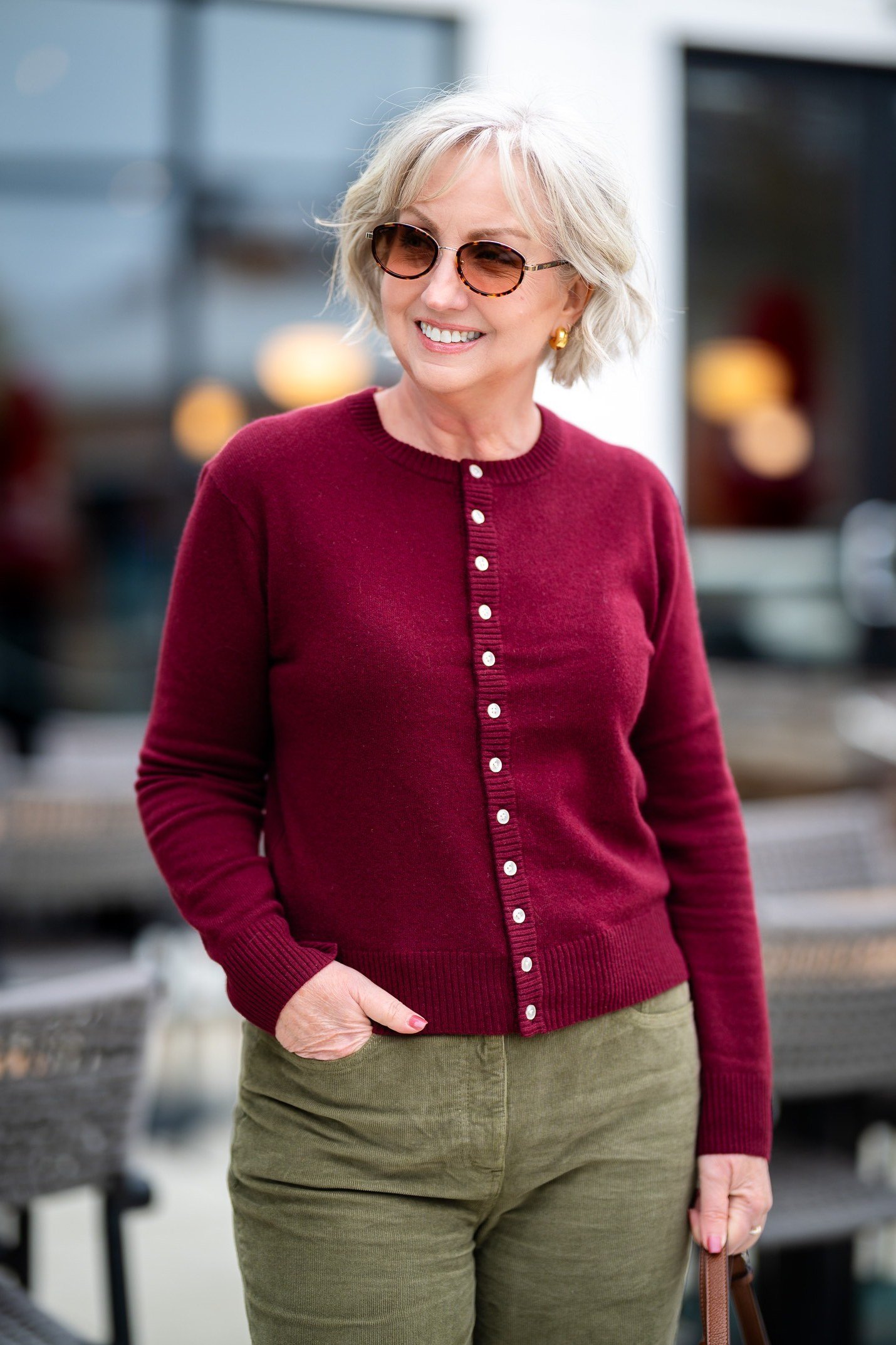 Burgundy button front cardigan over olive green trousers, rich jewel tone casual winter outfit for older women