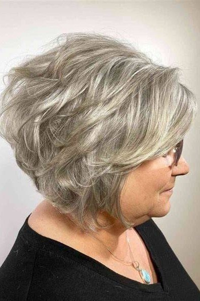 Short wolf cut for women over 60 - gray wolf, layered texture, black top, side view