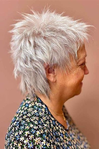Short wolf cut for women over 60 - white spiky wolf, bold texture, floral top, side view