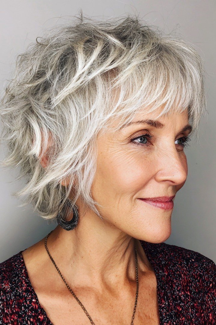 Short wolf cut for women over 60 - silver shaggy wolf with bangs, side view