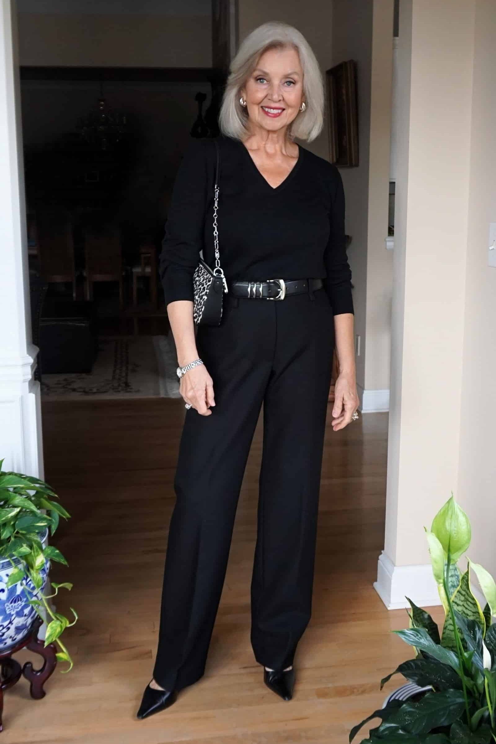 Black Jumpsuit, Belted, in a Doorway - work outfit idea for women over 50