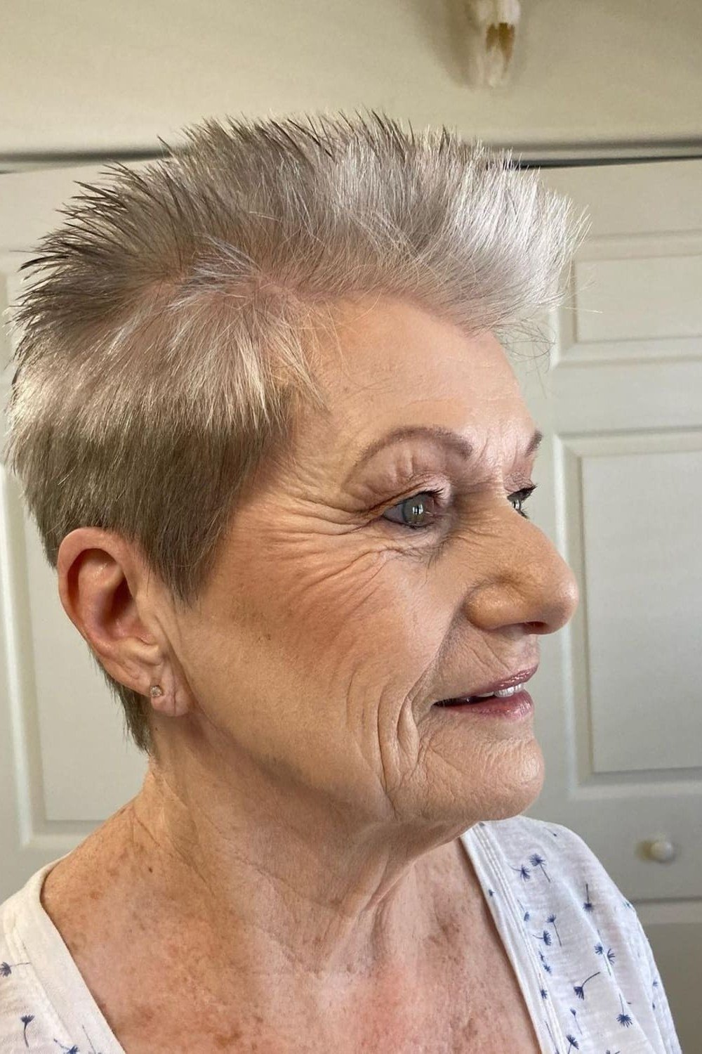 Salt-and-pepper textured pixie cut for senior women, wash-and-wear layered crop