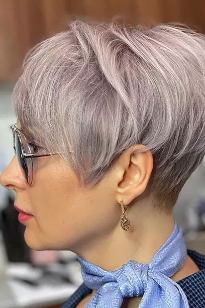 Lavender-gray pixie haircut with glasses for senior women, chic easy short style
