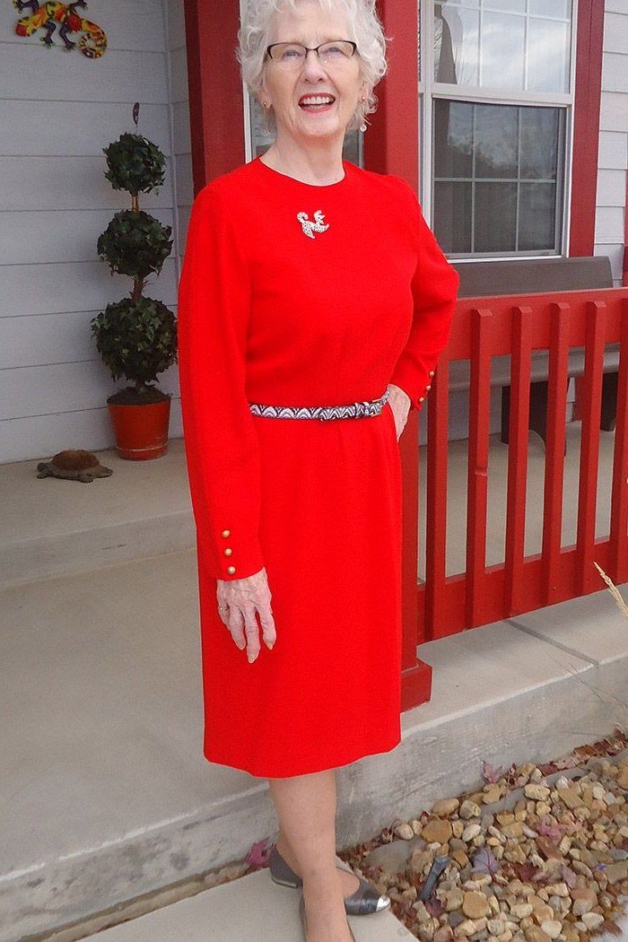 red long sleeve coat dress on festive holiday porch