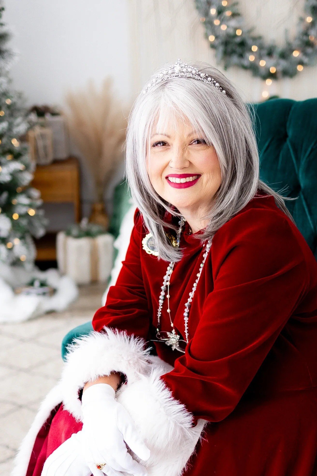 Burgundy Velvet Dress with White Fur Cuffs worn by older woman, burgundy velvet dress with white fur cuffs, gray hair