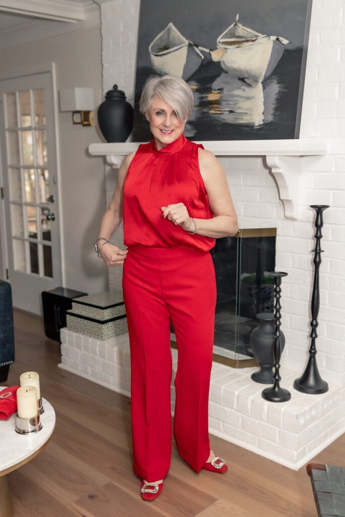 red halter top with red wide leg pants by fireplace