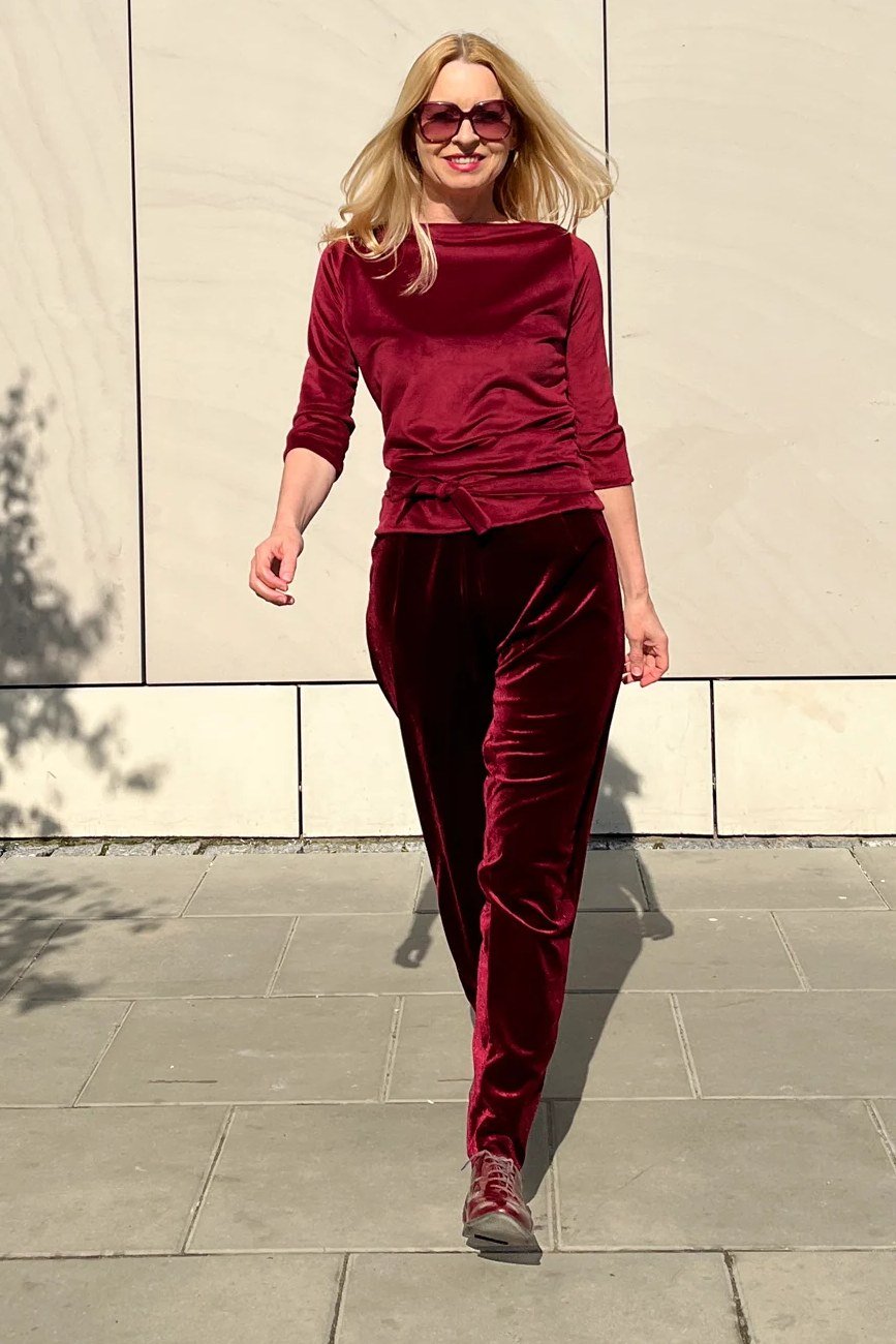burgundy velvet top and trousers styled outdoors for christmas