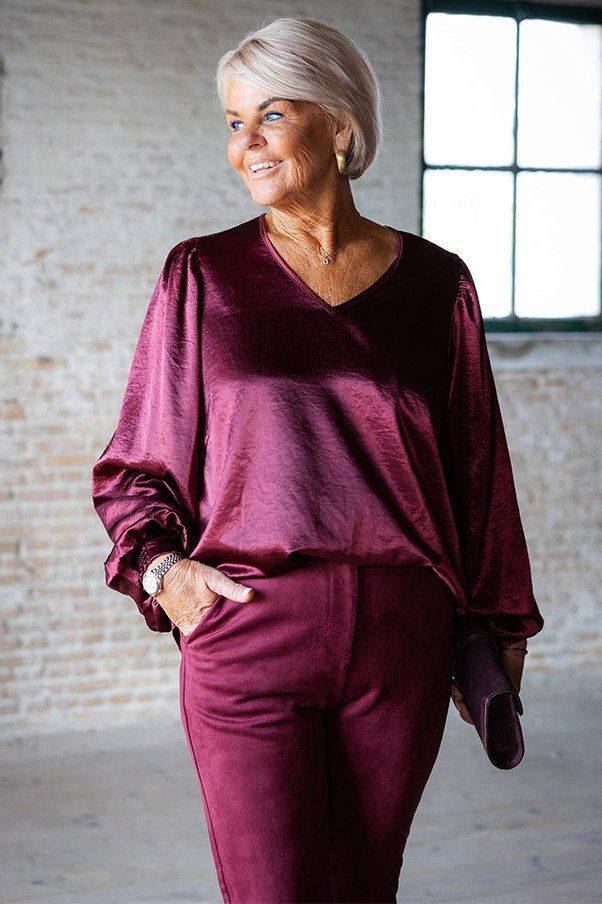 plum satin blouse with plum trousers elegant holiday outfit